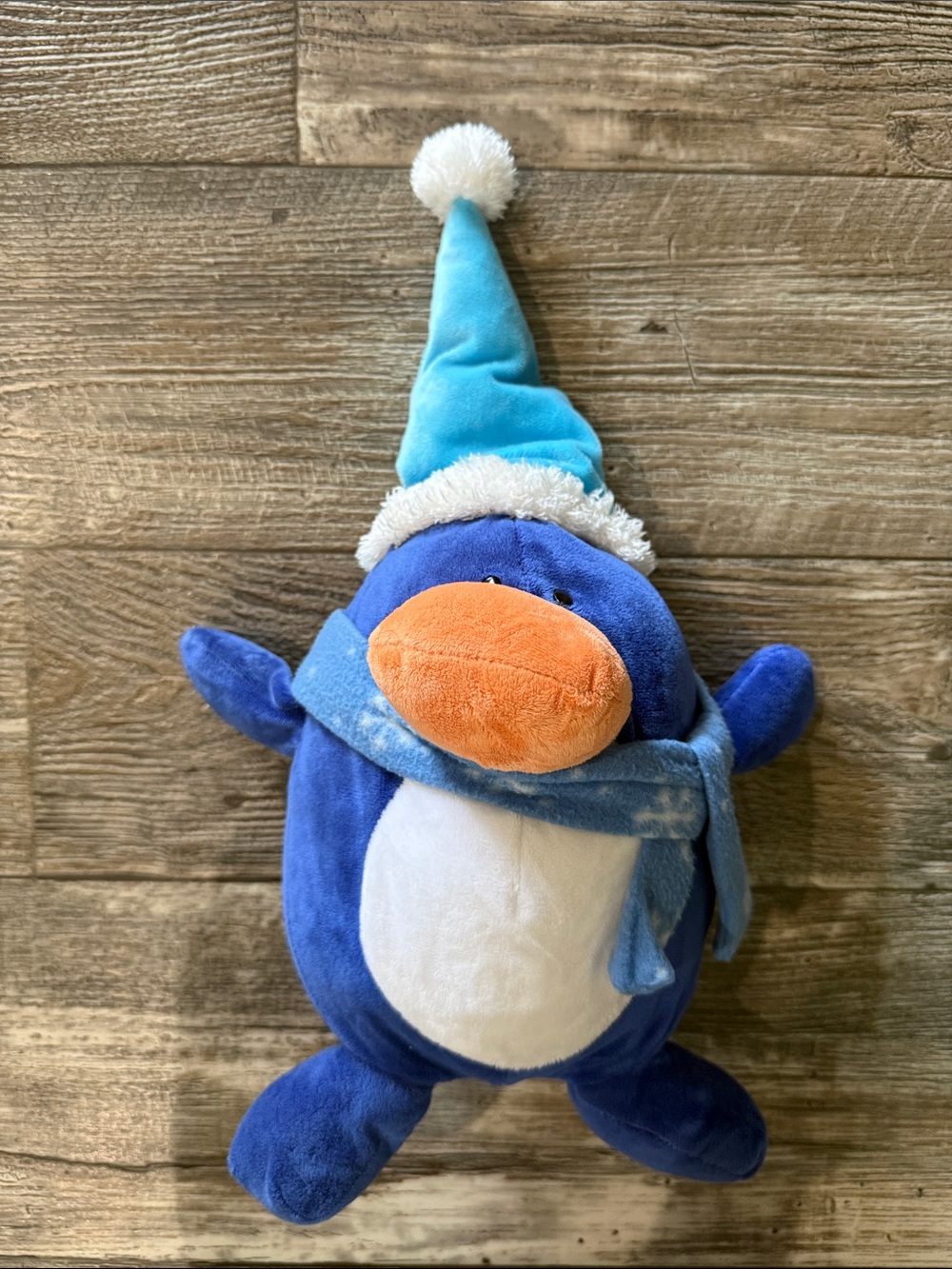 Blue Plush Penguin with Orange Beak and Cozy Hat